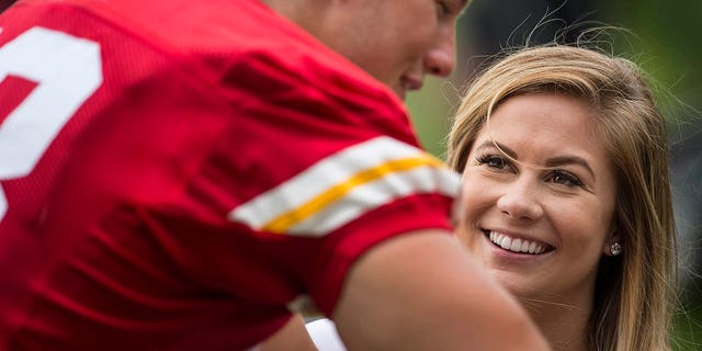Olympic gymnast Shawn Johnson visits her fiance, Kansas City Chiefs long snapper Andrew East (48), after the team's training camp practice Wednesday morning, Aug. 5, 2015, at Missouri Western State University in St. Joseph, Mo.