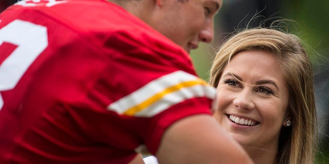 Olympic gymnast Shawn Johnson visits her fiance, Kansas City Chiefs long snapper Andrew East (48), after the team's training camp practice Wednesday morning, Aug. 5, 2015 at Missouri Western State University in St. Joseph, Mo.