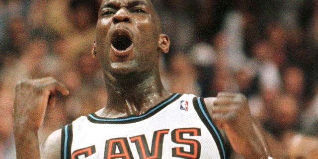 Shawn Kemp of the Cleveland Cavaliers reacts after hitting a shot in the fourth quarter of a playoff game against the Indiana Pacers.