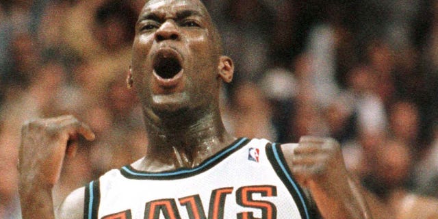 Shawn Kemp of the Cleveland Cavaliers reacts after hitting a shot in the fourth quarter of a playoff game against the Indiana Pacers.