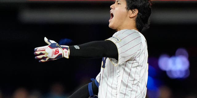 Japan's Shohei Ohtani celebrates after a double during the ninth inning of a World Baseball Classic game against Mexico, Monday, March 20, 2023, in Miami.