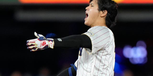 Japan's Shohei Ohtani celebrates after a double during the ninth inning of a World Baseball Classic game against Mexico, Monday, March 20, 2023, in Miami.