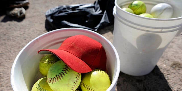 Softballs in a bucket