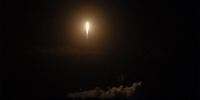 A SpaceX rocket launches into orbit at the Space Force Station in Cape Canaveral, Florida.