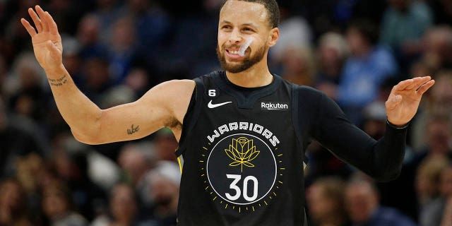 Golden State Warriors guard Stephen Curry, #30, acknowledges his foul against the Minnesota Timberwolves in the first quarter at Target Center Feb 1, 2023 in Minneapolis.
