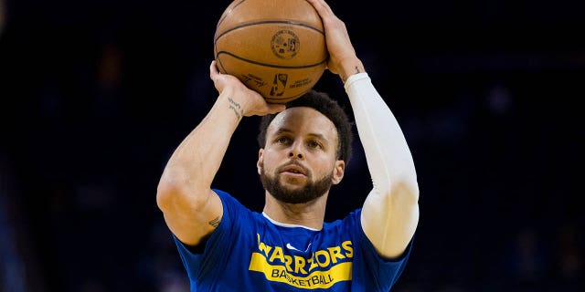 Golden State Warriors guard Stephen Curry, #30, shoots during warmups before the game against the Brooklyn Nets at Chase Center in San Francisco Jan. 22, 2023.