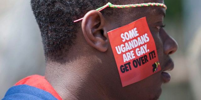 A Ugandan man is seen during the third Annual Lesbian, Gay, Bisexual and Transgender Pride celebrations in Entebbe, Uganda on Aug. 9, 2014.