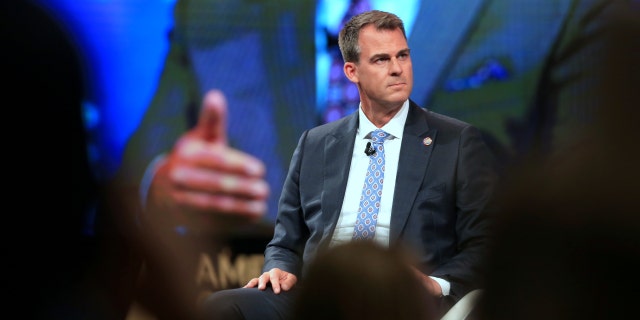 Kevin Stitt, governor of Oklahoma, listens during the Conservative Political Action Conference in Dallas, Texas, July 10, 2021.
