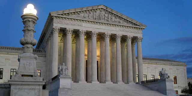 Supreme Court building at dusk on Capitol Hill in Washington.