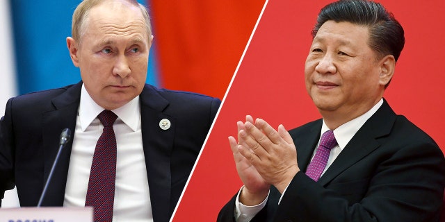 China's President Xi Jinping claps as he listens to Russian President Vladimir Putin via a video link in Beijing on Dec. 2, 2019.