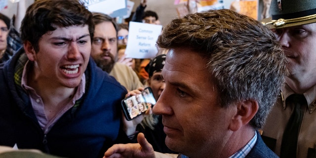Protestors gather inside the Tennessee state Capitol for stricter gun laws and one protestor yells at a lawmaker as he pushes through the crowd on March 30, 2023. On March 27, a 28-year-old former student who attended Covenant School in Nashville, used a handgun and two AR-style weapons, killed three 9-year-old students and three adults before police came to the school and killed the shooter.