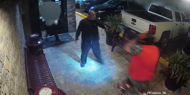 A single round from the gun hit the front door of the venue before the security guard was able to knock it out of the suspect's hand.