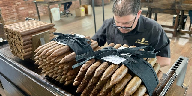 Tampa cigar maker Luis Gonzalez hand-rolls cigars at J.C. Newman Cigar Co. in Ybor City, Tampa, Florida, in February 2023.