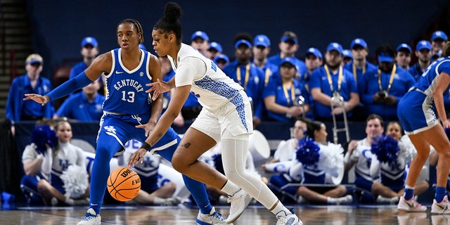 Tatyana Wyche #2 of the Florida Gators dribbles against Ajae Petty #13 of the Kentucky Wildcats in the second quarter during the first round of the SEC Women's Basketball Tournament at Bon Secours Wellness Arena on March 1, 2023 in Greenville, SC South.