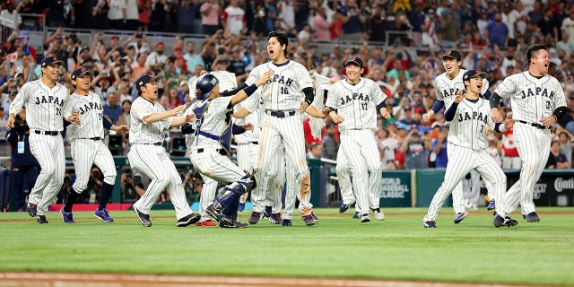 Shohei Ohtani (16) of Team Japan celebrates after defeating Team USA during the World Baseball Classic championship game at LoanDepot Park on March 21, 2023 in Miami, Florida.