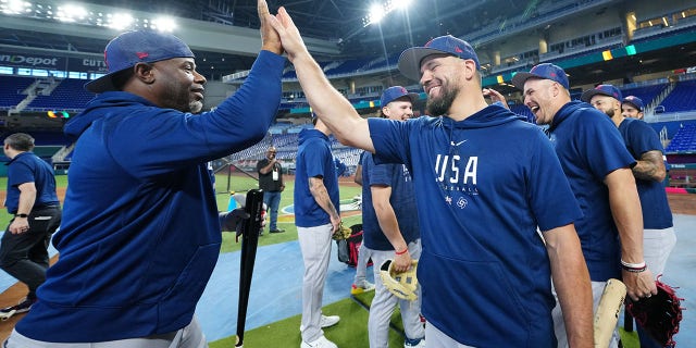 Hitting coach Ken Griffey Jr., #24, celebrates with Kyle Schwarber, #12 of Team USA, after batting practice during the Team USA workout prior to the 2023 World Baseball Classic Quarterfinal game between Team Puerto Rico and Team Mexico at loanDepot Park on Friday, March 17, 2023, in Miami, Florida.