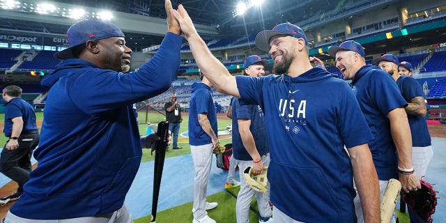 Hitting coach Ken Griffey Jr., #24, celebrates with Team USA's Kyle Schwarber, #12, after batting practice during Team USA's workout prior to the quarterfinal game of the 2023 World Baseball Classic between Team Puerto Rico and Team Mexico at LoanDepot Park on Friday, March 17, 2023, in Miami, Florida.