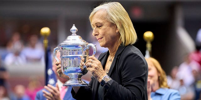 Martina Navratilova gets the championship trophy