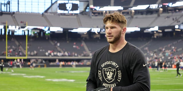 Las Vegas Raiders tight end Foster Moreau warms up before a game against the New England Patriots at Allegiant Stadium on December 18, 2022 in Las Vegas.