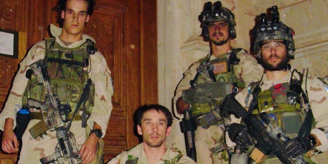 Picture was taken on Nov 26, 2003, after an assault in Tikrit, Iraq. The picture is outside the team's Mission Support Site in Tikrit roughly two weeks before the capture of Saddam Hussein. Pictured left to right, Chris VanSant, Mike Hefner, Brad Thomas and Craig Palmer.