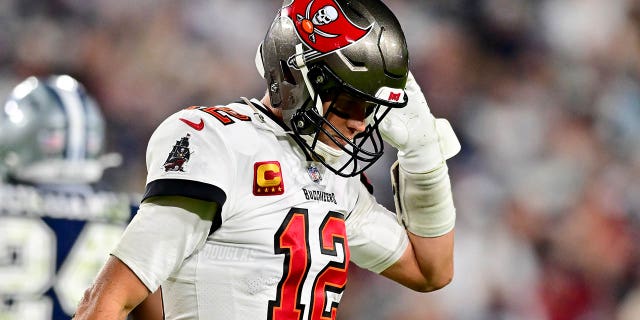 Tom Brady of the Buccaneers reacts after a sack in the NFC wild-card playoff game against the Dallas Cowboys at Raymond James Stadium on Jan. 16, 2023, in Tampa, Florida.