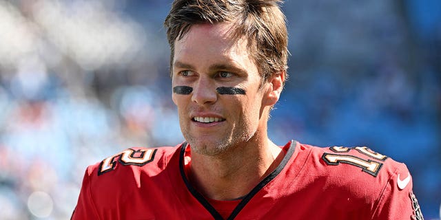 Tom Brady of the Tampa Bay Buccaneers warms up before the Panthers game at Bank of America Stadium on October 23, 2022 in Charlotte, North Carolina.