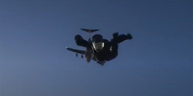 Tom Cruise jumping out of a plane as part of a stunt for "Mission Impossible: Fallout"