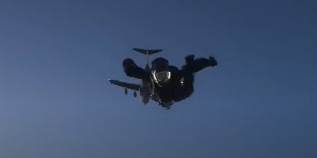 Tom Cruise jumping out of a plane as part of a stunt for "Mission Impossible: Fallout"