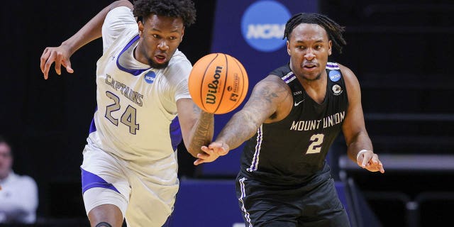 Captains' Trey Barber and Purple Raiders' Collen Gurley chase down a loose ball during the Division III Championship game on March 18, 2023 in Fort Wayne, Indiana.