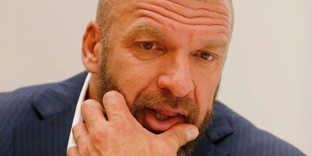 WWE Executive Vice President of Talent, Live Events &  creative paul "Triple H" Levesque speaks during an interview before the taping of WWE's NXT show at Full Sail University in Winter Park, Florida on November 30, 2016.