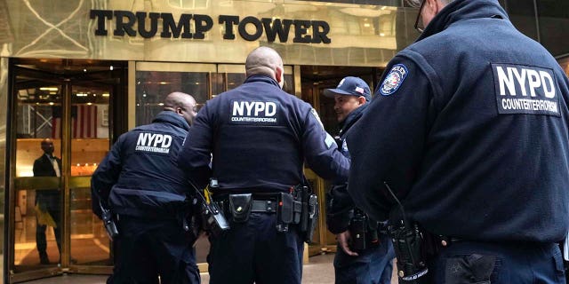 Several members of the NYPD enter Trump Tower in New York on Friday. Former President Donald Trump was indicted Thursday by a Manhattan grand jury, a historic reckoning after years of investigations into his personal, political and business dealings and an abrupt jolt to his bid to retake the White House. 