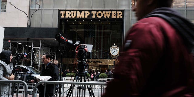 People walk by Trump Tower the morning after former president Donald Trump was indicted by a New York jury on March 31, 2023, in New York City. 