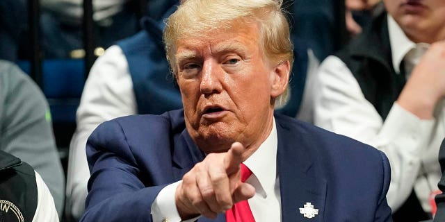 Former President Donald Trump watches the NCAA Wrestling Championships, Saturday, March 18, 2023, in Tulsa, Oklahoma.