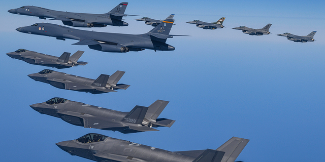 U.S. Air Force B-1B bombers fly in formation with South Korean Air Force F-35A fighters and U.S. Air Force F-16s during a military exercise in South Korea, Sunday, March 19, 2023. 
