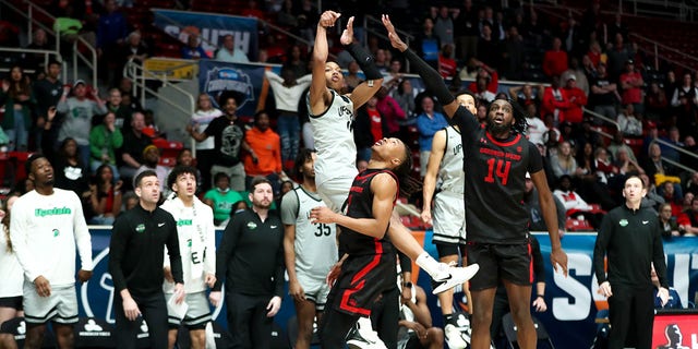 Jordan Gainey (11) of the USC Upstate Spartans shoots the game-winning shot during the Big South Tournament against the Gardner-Webb Runnin' Bulldogs March 3, 2023, at Bojangles Coliseum in Charlotte, N.C.