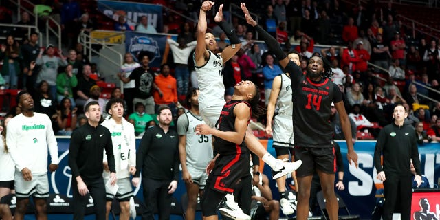 Jordan Gainey (11) of the USC Upstate Spartans shoots the game-winning shot during the Big South Tournament against the Gardner-Webb Runnin' Bulldogs March 3, 2023, at Bojangles Coliseum in Charlotte, N.C.