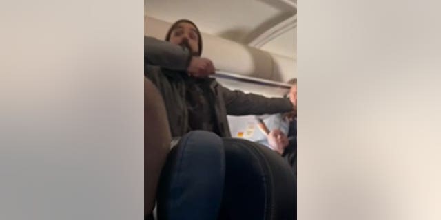 Torres is seen on video threatening others, warning not to stop him at risk of being stabbed on a United flight from LA to Boston.