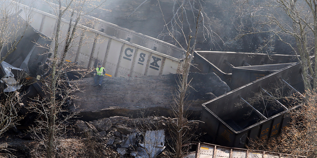 Smoke fills the sky after an empty CSX coal train hit a rockslide along tracks causing a fiery derailment on Wednesday, March 8, 2023 in a remote area just south of Sandstone, W.Va. Four locomotives and 22 empty cars derailed in Summers County near the New River, CSX said. The lead locomotive, which carried a conductor, an engineer and an engineer trainee, caught fire and the crewmembers were being evaluated and treated for non-life threatening injuries, the company said.