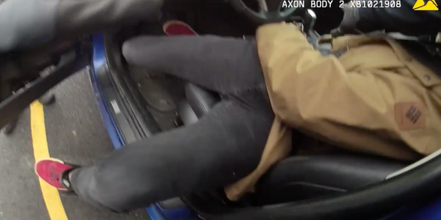 Officials also said there was "motion of his arm near his holster" before police fired shots, adding that a gun was located on the floor of the front seat after Chase Allan was shot and removed from the car.