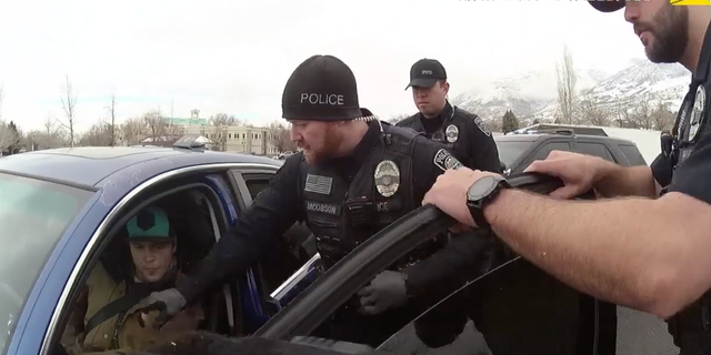 The officer asks Allan to step out of the car, and he replies "No, I am not required to."