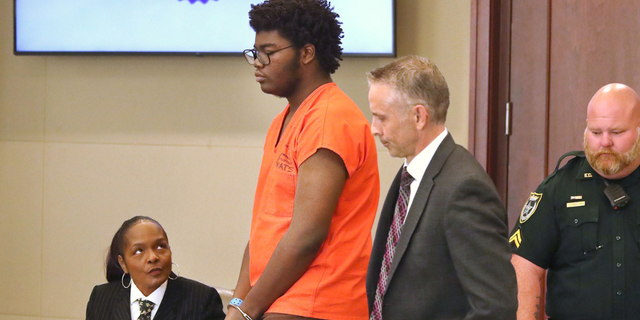 Brendan Depa with his attorneys, Thursday March 9, 2023 during a hearing before Judge Chris France, at the Kim C. Hammond Justice Center in Bunnell, where Joan Naydich is seeking a permanent injunction against the Matanzas High School student accused of attacking her.