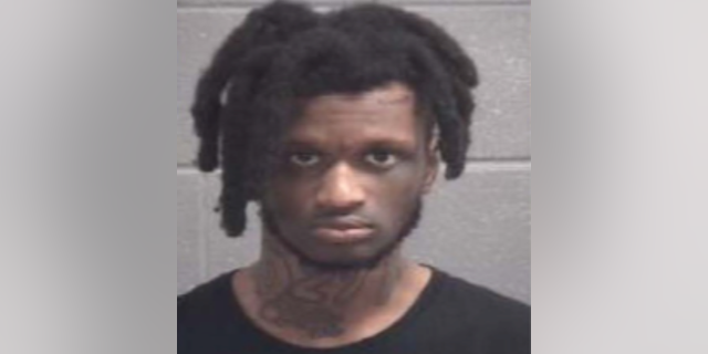 FILE- Dix said that the suspect, 22-year-old Kionta Parks, hasn't been arrested and is wanted for one count of felony murder, four counts of possession of a firearm during the commission of a crime, three counts of aggravated assaults, 14 counts of violating the Georgia Criminal Street Gang Act, cruelty to children, and domestic terrorism.