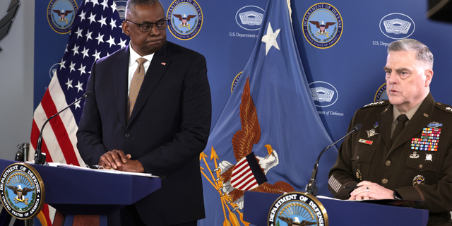 U.S. Secretary of Defense Lloyd Austin (L) listens as Chairman of the Joint Chiefs of Staff Army Gen. Mark Milley speaks during a press conference at the Pentagon on March 15, 2023 in Arlington, Virginia. Secretary Austin and Gen. Milley discussed various topics including the downing of an American MQ-9 Reaper drone in the Black Sea by Russian fighter jets.