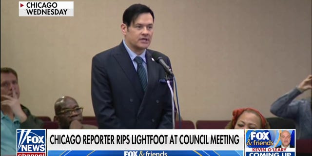 Reporter William Kelly calls out Chicago Mayor Lori Lightfoot at a city council meeting. 