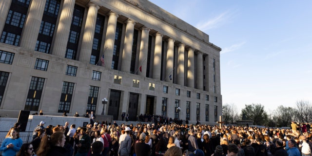 A crowd gathers outside the courthouse and City Hall for a vigil held for victims of The Covenant School shooting on Wednesday, March 29, 2023, in Nashville, Tennessee.