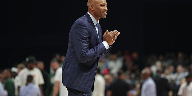 Vince Carter smiles for the fans on the court during the Atlanta Hawks game against the Milwaukee Bucks as part of 2022 NBA Abu Dhabi Games at Etihad Arena on October 8, 2022 in Abu Dhabi, The United Arab Emirates.
