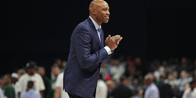 Vince Carter smiles for fans on the court during the Atlanta Hawks' game against the Milwaukee Bucks as part of the 2022 NBA Abu Dhabi Games at the Etihad Arena on October 8, 2022 in Abu Dhabi, United Arab Emirates.