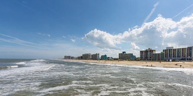 A beautiful section of the Virginia Beach oceanfront has a sparse crowd today for the start of Memorial Day weekend on May 22, 2020, in Virginia Beach, Va.