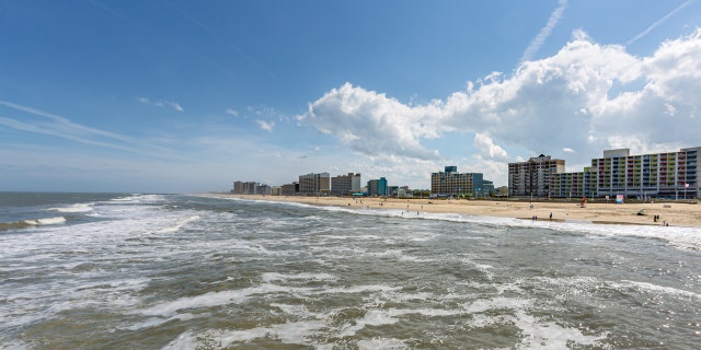 A beautiful section of the Virginia Beach oceanfront has a sparse crowd today for the start of Memorial Day weekend on May 22, 2020, in Virginia Beach, Va.