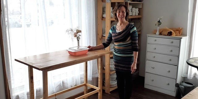 Yvette Egan stands in her workspace in Madison, Wisconsin. She's the owner of the Etsy shop known as ParkwoodTreasures, which sells vintage Pyrex bowls in mint condition.